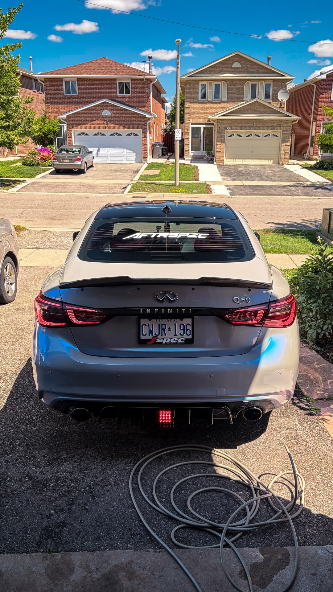 Grey Infiniti Q50 with AFTRSPEC rear-window banner