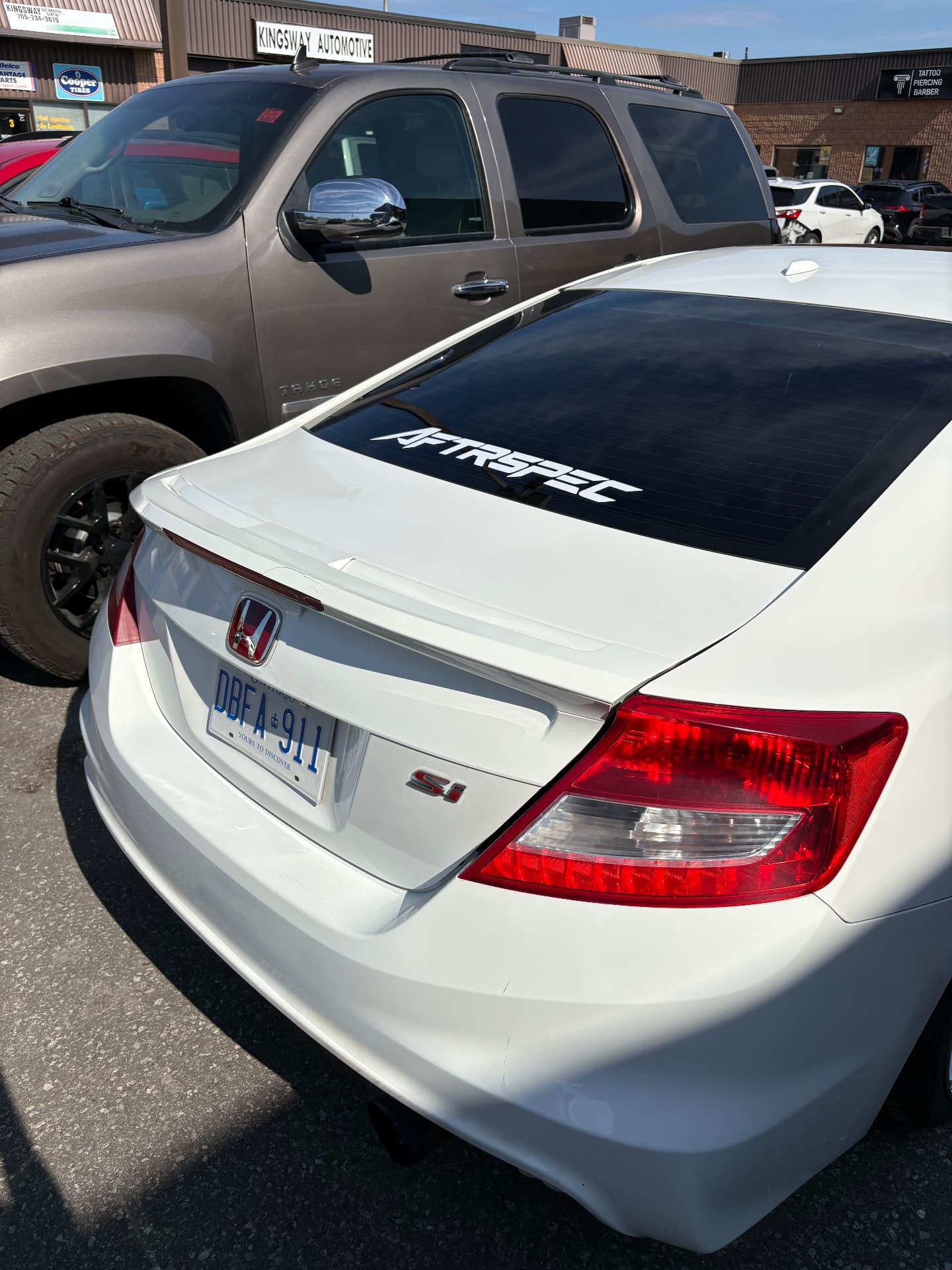 White Honda Civic Si with AFTRSPEC rear-window banner