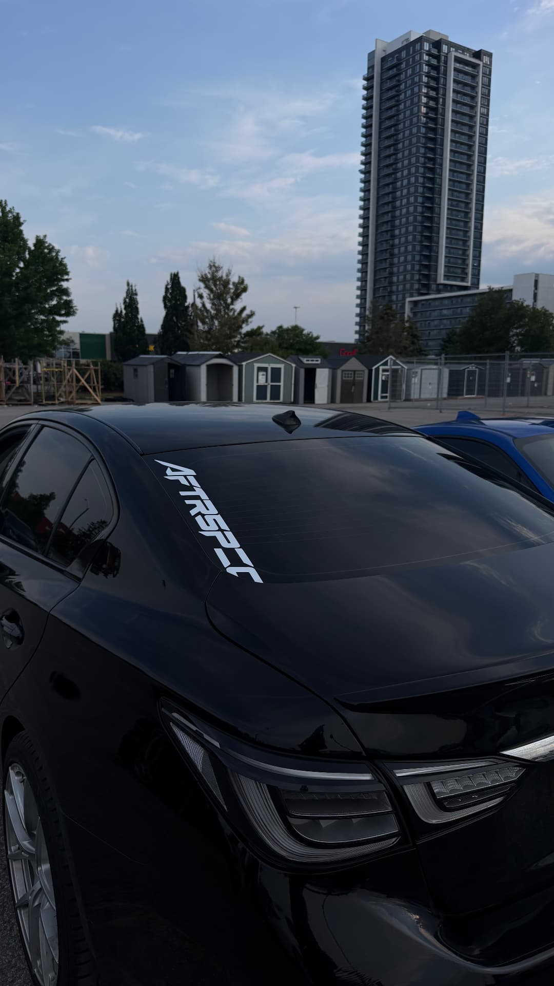 Black sedan with AFTRSPEC windshield banner