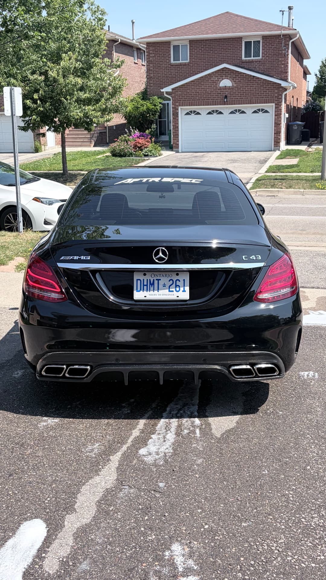 Black Mercedes-AMG C43 with AFTRSPEC rear-window banner